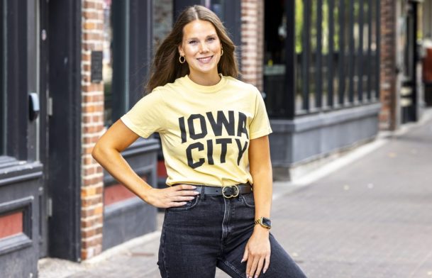 Kylee Stock wears a yellow Iowa City shirt for a Shop Think Iowa City merchandise photo shoot, Friday, Sept. 13, 2024, in Iowa City, Iowa. MANDATORY CREDIT: Joseph Cress/Think Iowa City
